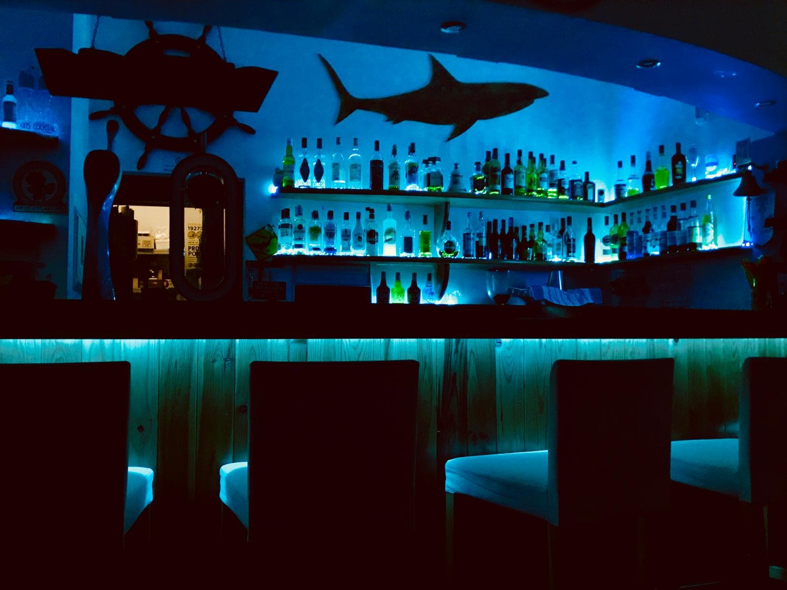 Bar area at night with blue lighting