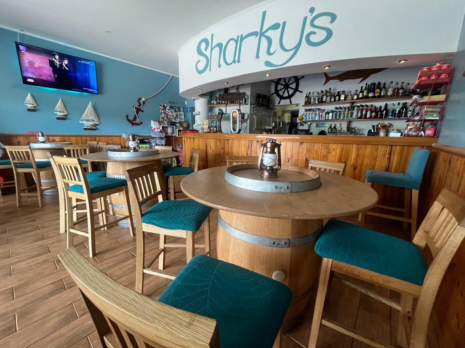 Interior of Sharky's Bar with barrel tables
