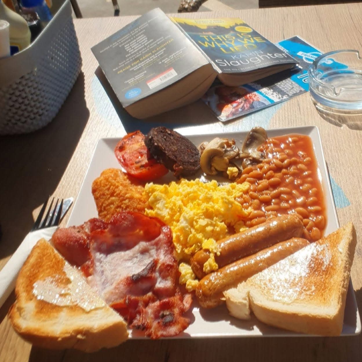 Full English breakfast with scrambled egg, bacon, sausages, beans, black pudding and toast at Sharky's Bar, Albufeira