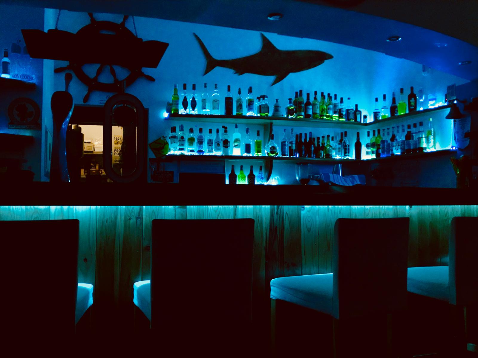 Bar area at night with blue lighting